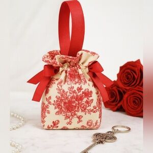 Floral RED Canvas Mini Drawstring Bag. Red. 5.75 tall x 3.75 wide x 2 inches.